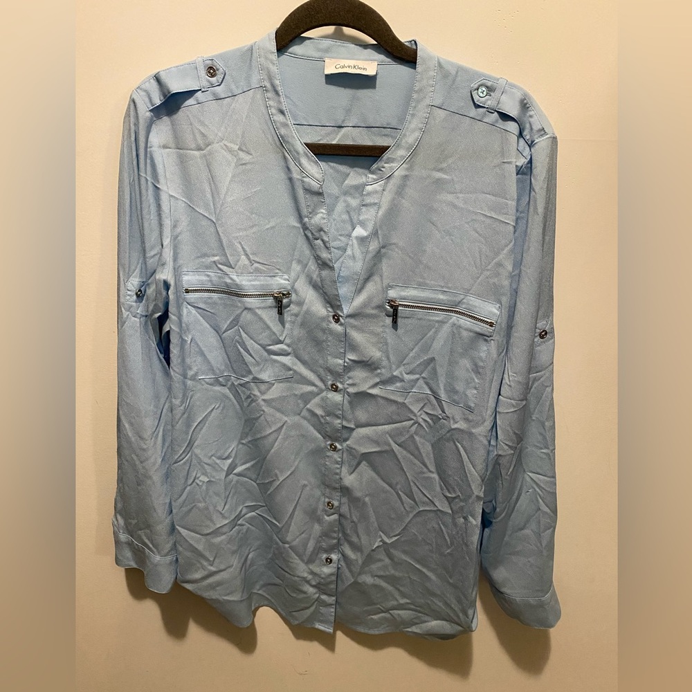 Light a blue Calvin Klein blouse w/silver accent